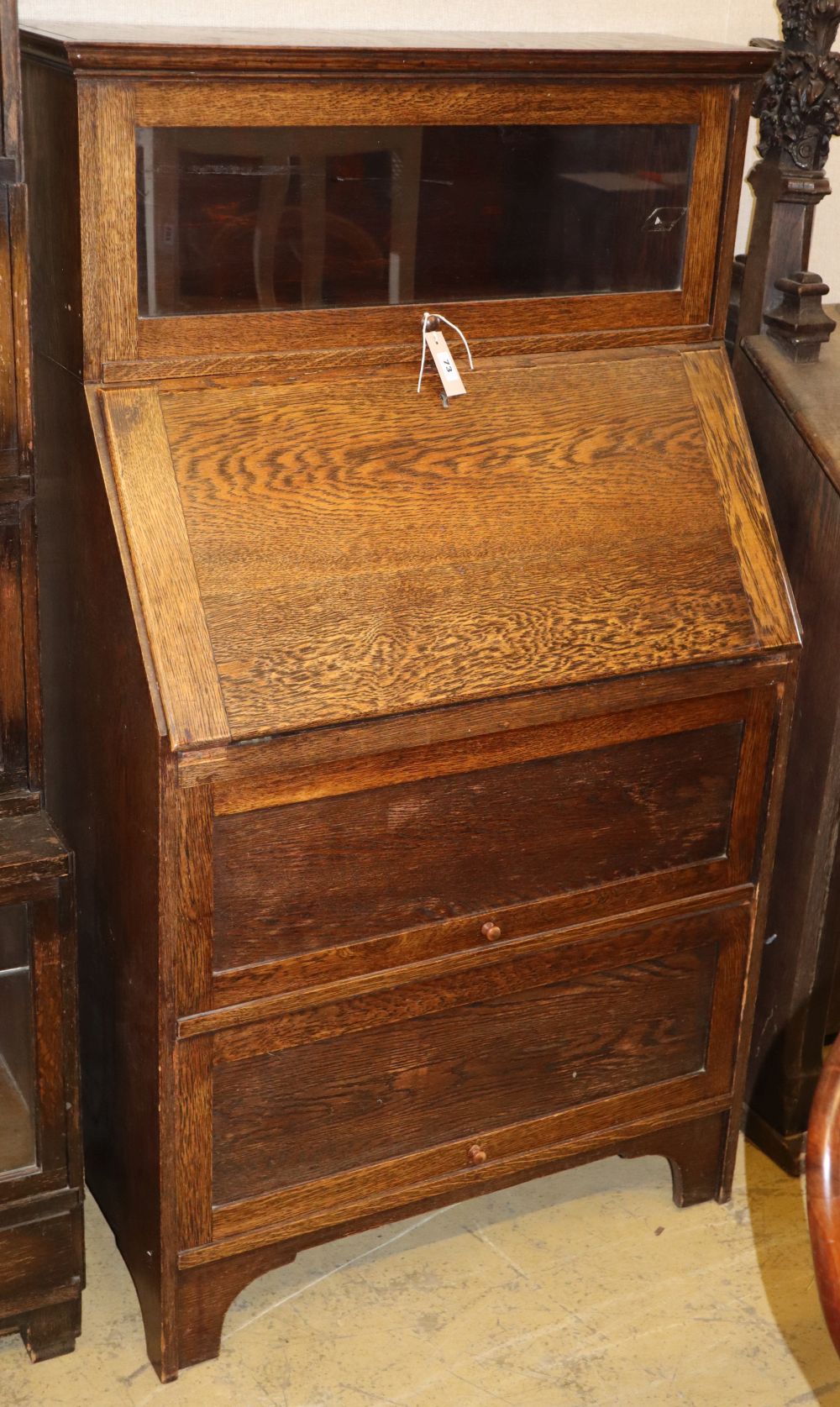 A Globe Wernicke style oak bureau bookcase, W.79cm, D.42cm, H.138cm
